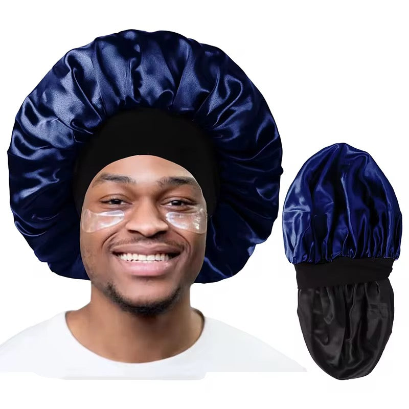 A black man smiling wearing a Unisex Satin Hair Bonnet in a Navy Blue colour, with a side image showcasing that the hair bonnet is double-lined with satin for extra hair protection.